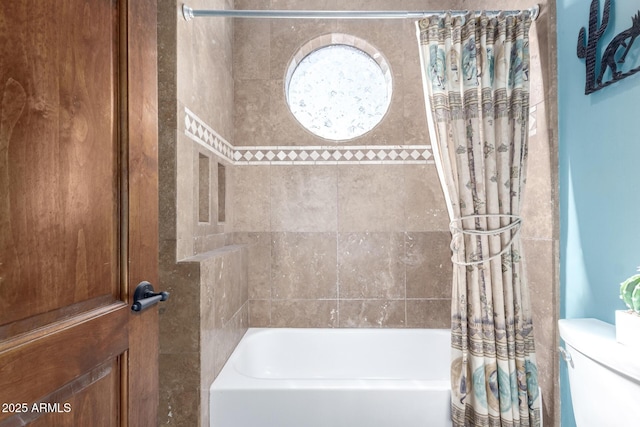 bathroom featuring toilet and shower / bath combo with shower curtain