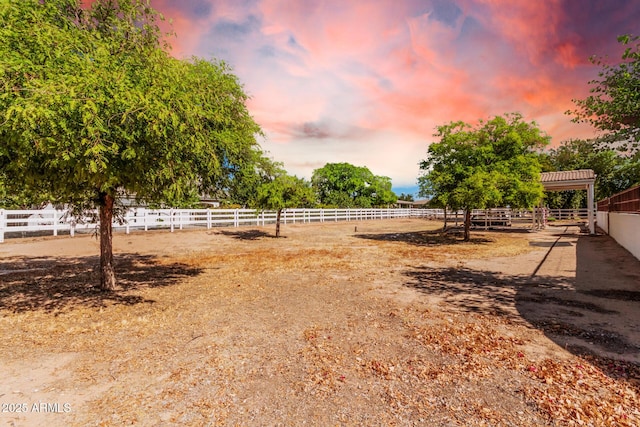 view of yard at dusk