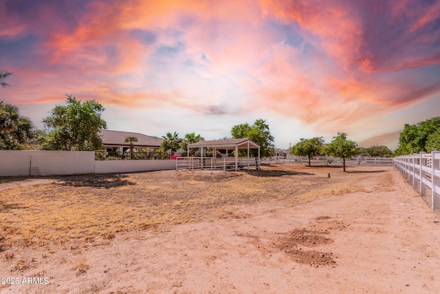 view of yard at dusk