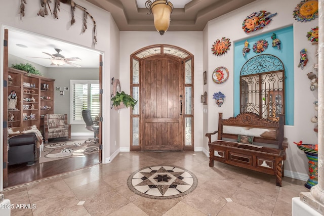 entrance foyer with ceiling fan