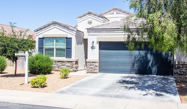 2410 E San Gabriel Trl, Casa Grande, AZ 85194 - view of front of house with driveway, stucco siding, an attached garage, stone siding, and a tile roof