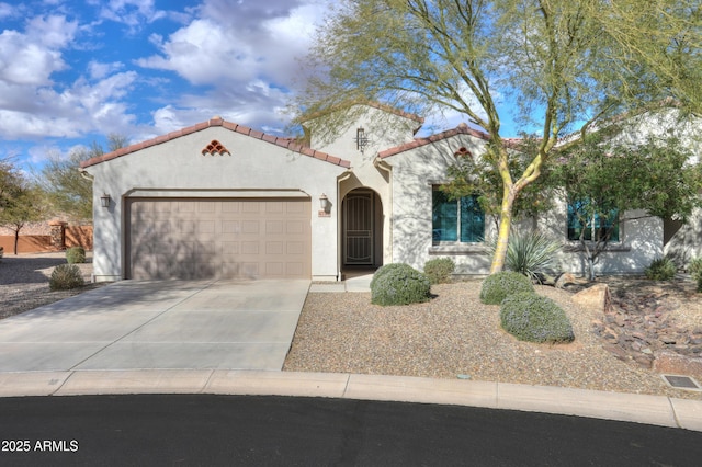 mediterranean / spanish-style home with a garage