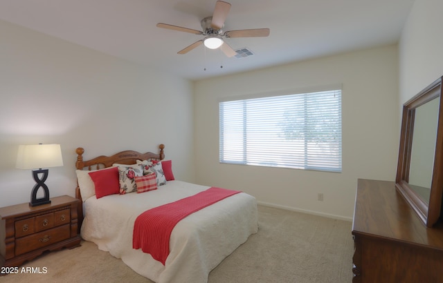 bedroom with ceiling fan and light colored carpet