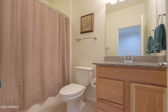 bathroom with toilet and vanity