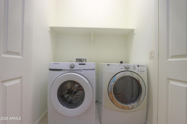 washroom featuring washer and dryer