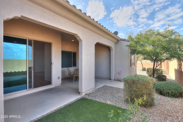 entrance to property with a patio area