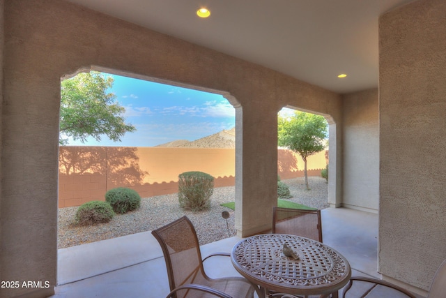 patio terrace at dusk with a mountain view