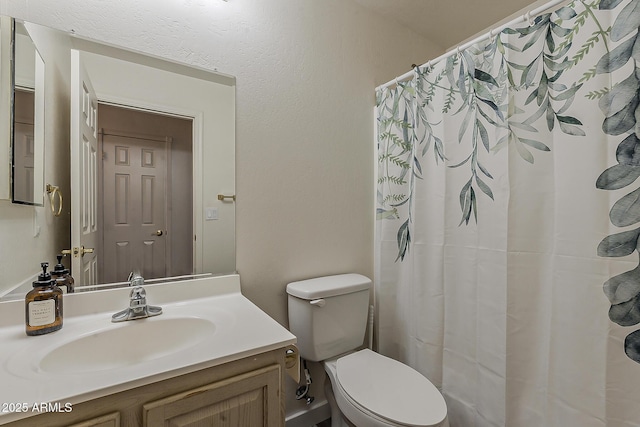 full bathroom with vanity, toilet, and a shower with curtain