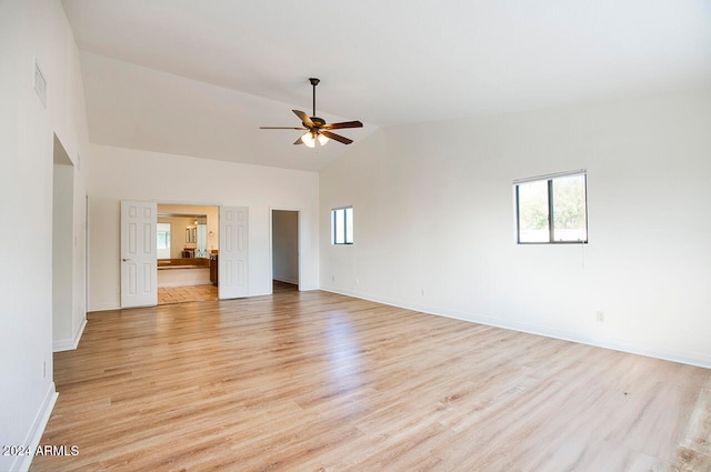 spare room featuring ceiling fan, high vaulted ceiling, and light hardwood / wood-style floors