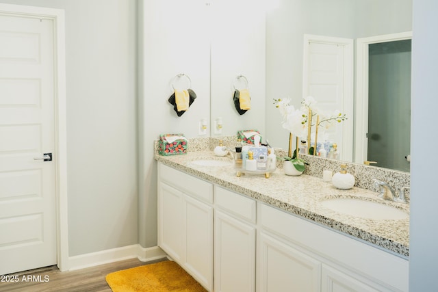 bathroom with vanity and hardwood / wood-style flooring