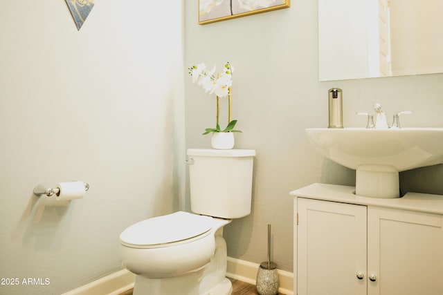 bathroom featuring toilet and sink