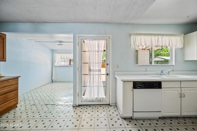 312 W Saddle Ln, Payson, AZ 85541 - kitchen with dishwasher, light floors, light countertops, white cabinets, and a textured ceiling