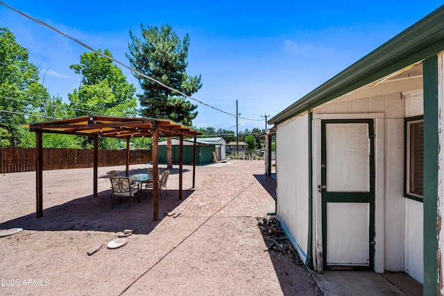 312 W Saddle Ln, Payson, AZ 85541 - fenced backyard with a patio, a storage shed, and outdoor dining area