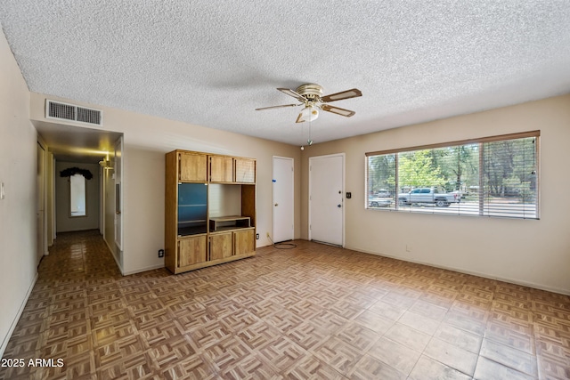 312 W Saddle Ln, Payson, AZ 85541 - unfurnished living room featuring ceiling fan and a textured ceiling