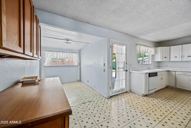312 W Saddle Ln, Payson, AZ 85541 - kitchen with dishwasher, light countertops, light flooring, a textured ceiling, and white cabinetry