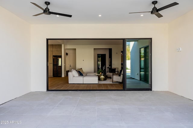 exterior space featuring a ceiling fan