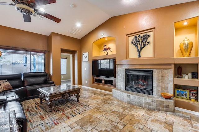 living room featuring ceiling fan, lofted ceiling, and built in features