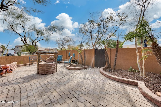 view of patio / terrace featuring a fire pit