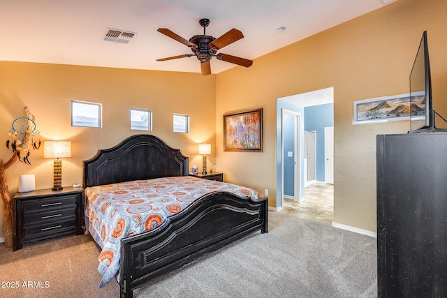 carpeted bedroom featuring lofted ceiling and ceiling fan