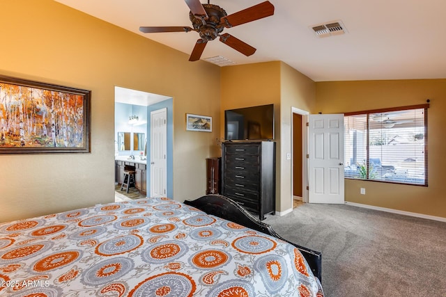 unfurnished bedroom featuring lofted ceiling, light colored carpet, connected bathroom, and ceiling fan