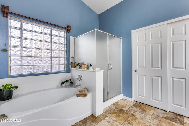 bathroom with separate shower and tub