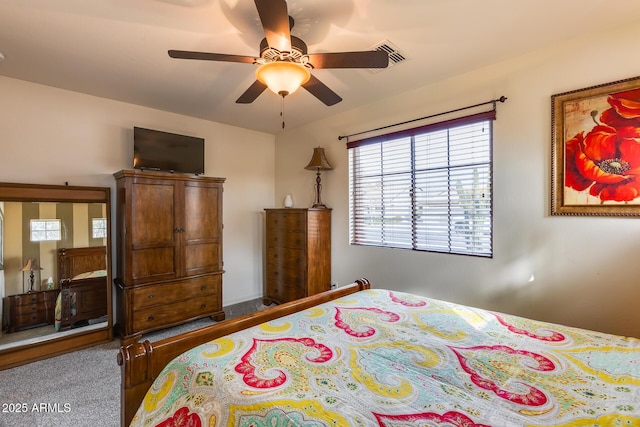 bedroom with ceiling fan and carpet