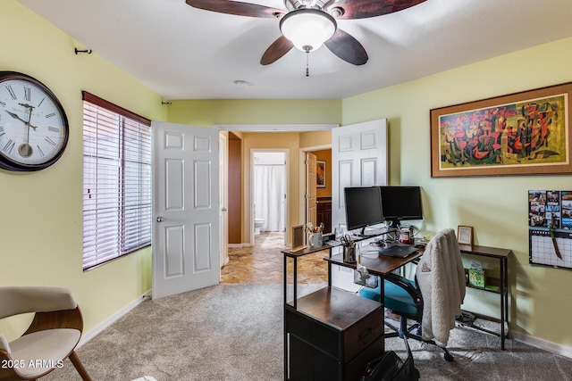 home office featuring ceiling fan and carpet floors