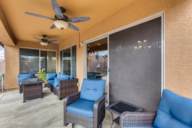 view of patio with ceiling fan and outdoor lounge area