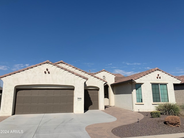 mediterranean / spanish-style house featuring a garage