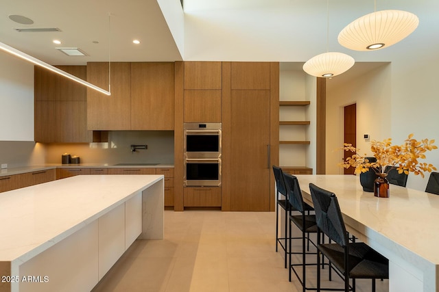 kitchen with double oven, modern cabinets, and open shelves