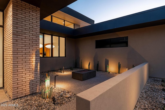 view of patio with an outdoor fire pit