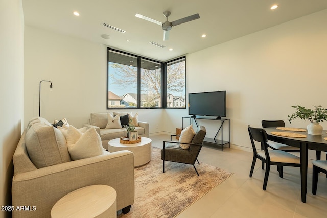 living room with visible vents, recessed lighting, baseboards, and a ceiling fan