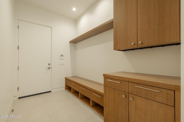 mudroom with light tile patterned flooring and recessed lighting