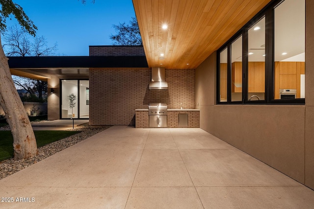 view of patio featuring exterior kitchen and area for grilling