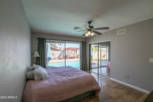 bedroom with wood-type flooring, access to outside, a textured ceiling, and ceiling fan