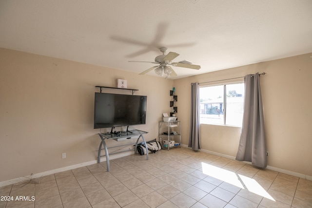 unfurnished living room with light tile patterned floors and ceiling fan