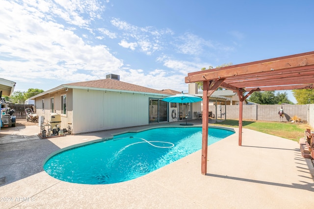 view of swimming pool featuring a pergola and a patio