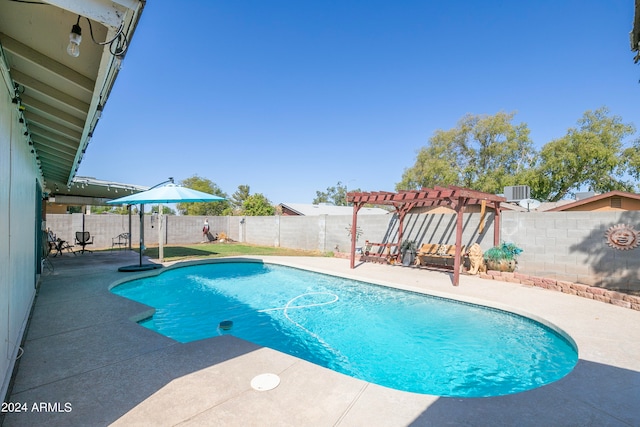 view of pool with a patio and a pergola