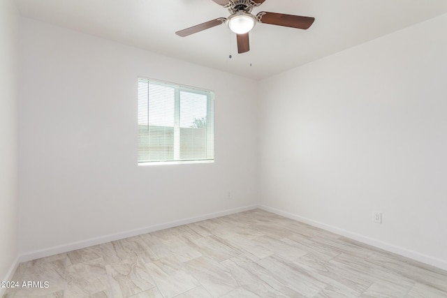 unfurnished room with ceiling fan