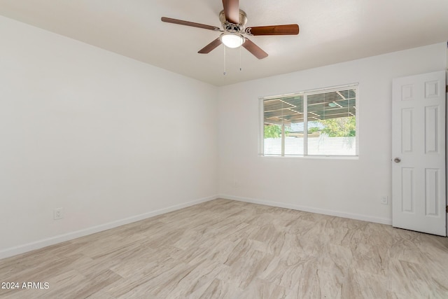 spare room featuring ceiling fan