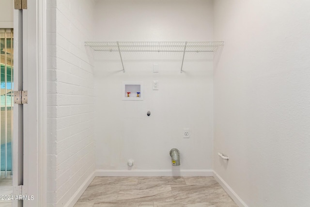 clothes washing area featuring electric dryer hookup, hookup for a gas dryer, and washer hookup