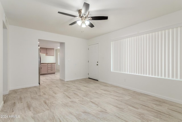 unfurnished room featuring ceiling fan