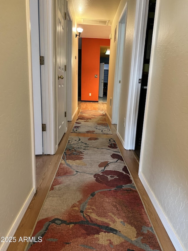 hallway featuring light wood-type flooring