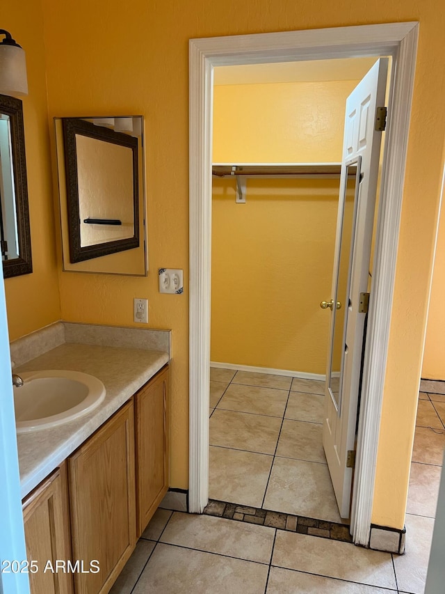 bathroom featuring tile patterned floors and vanity