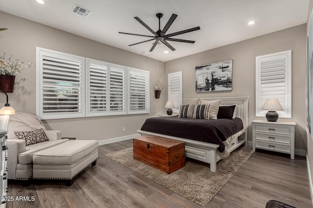 bedroom with ceiling fan and wood-type flooring