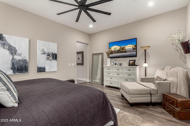 bedroom featuring ceiling fan and hardwood / wood-style flooring