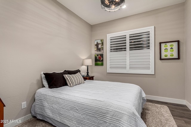 bedroom featuring dark hardwood / wood-style flooring