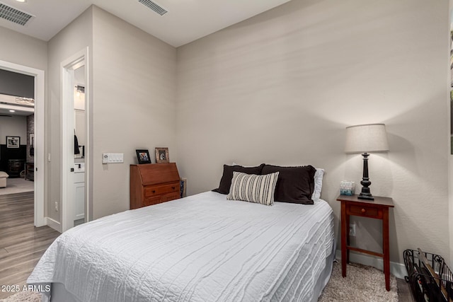 bedroom featuring wood-type flooring