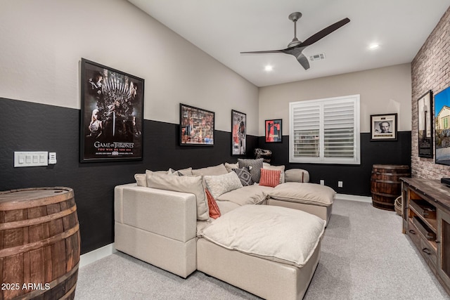 living room with ceiling fan and light carpet