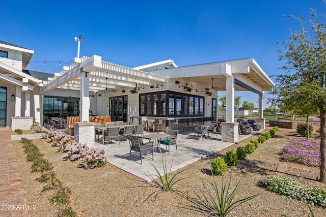 exterior space with ceiling fan and a pergola